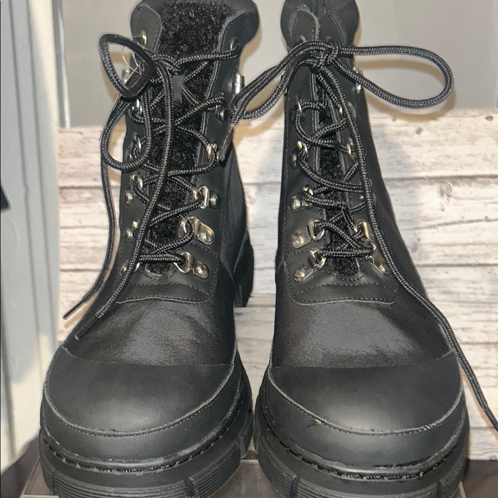 Steve Madden Black Combat Boots with Lace-Up Design and Thick Rubber Sole